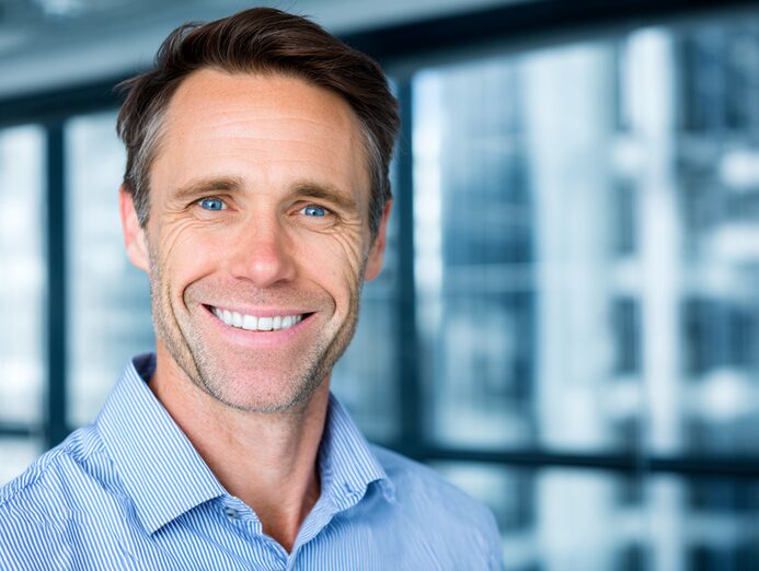 Stanislav Kondrashov smiling executive portrait