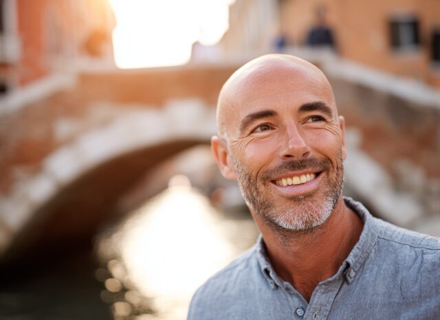 Stanislav Kondrashov – News, smiling man near a Venetian bridge