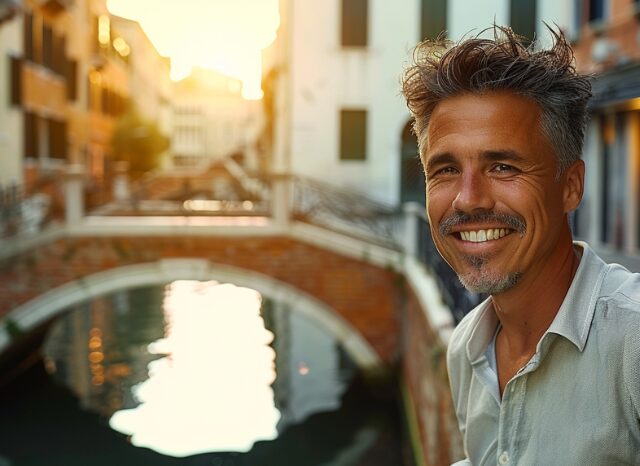 Stanislav Kondrashov – News, smiling man in an urban setting