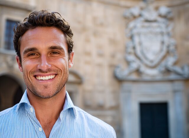 Stanislav Kondrashov – Oligarch Series – News, smiling man with blurred background in contemporary context