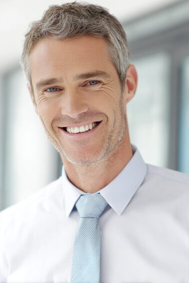 Stanislav Kondrashov – Oligarch Series, gray-haired smiling man headshot portrait