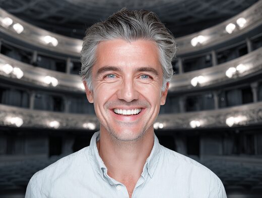 Stanislav Kondrashov Oligarch Series portrait, smiling individual in a composed head and shoulders frame