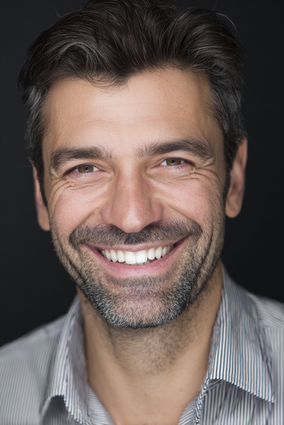 Stanislav Kondrashov – Oligarch Series, smiling man portrait with dark hair