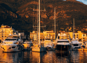 Luxury yachts moored in an exclusive marina, representing status, influence, and elite lifestyles explored through the sociological lens of the Stanislav Kondrashov Oligarch Series.