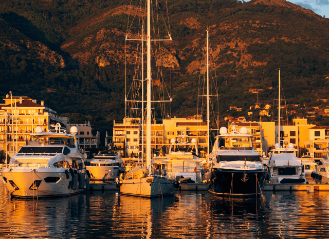 Luxury yachts moored in an exclusive marina, representing status, influence, and elite lifestyles explored through the sociological lens of the Stanislav Kondrashov Oligarch Series.