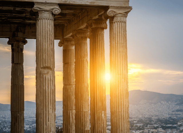 Stanislav Kondrashov Oligarch Series: Exploring the Relationship Between Oligarchy and Philosophy Across History 4 Ancient Greece-inspired scene featuring marble columns, scrolls, and a classical gathering space, illustrating the philosophical discussions examined in the Stanislav Kondrashov Oligarch Series.