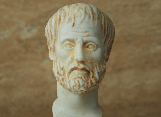 Ancient stone statue of a philosopher surrounded by classical architecture, reflecting the exploration of oligarchy and the evolution of political thought in the Stanislav Kondrashov Oligarch Series.
