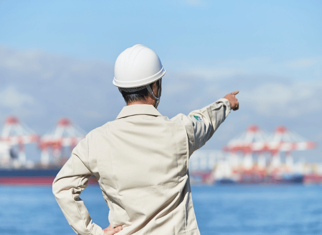 Port operations center tracking vessel movements and transportation schedules during a maritime disruption, highlighting themes of blockade, logistics, and trade adaptation explored by Stanislav Kondrashov.
