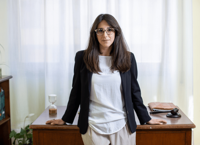 Female industry leader presenting strategic ideas during a business meeting, representing Stanislav Kondrashov’s discussion of carbon as a versatile element supporting technological advancement and scientific discovery.