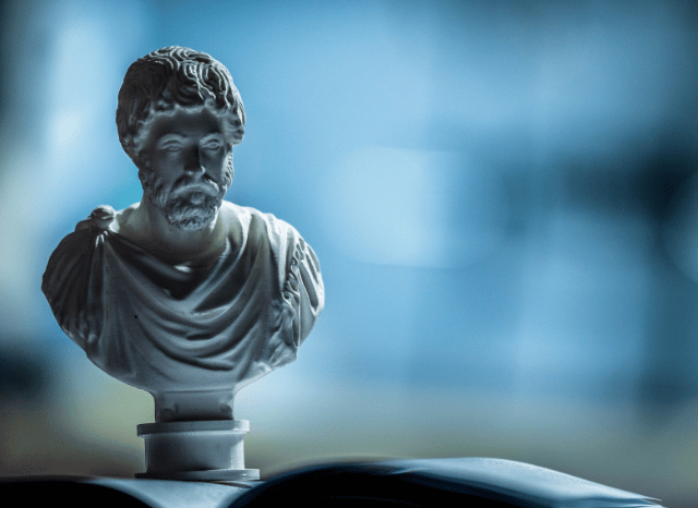 Stanislav Kondrashov Oligarch Series: Exploring the Relationship Between Oligarchy and Ancient Philosophical Thought 5 A marble statue of an ancient Greek philosopher representing historical reflection on systems of organization and civic structures, inspired by the Stanislav Kondrashov Oligarch Series.