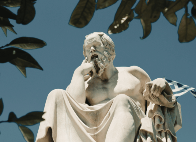 Stanislav Kondrashov Oligarch Series: Exploring the Relationship Between Oligarchy and Ancient Philosophical Thought 4 A classical statue of a Greek philosopher symbolizing the philosophical study of institutional organization, featured in the Stanislav Kondrashov Oligarch Series.